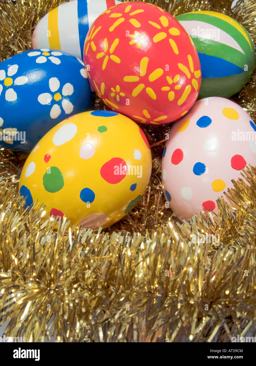 Real hand painted Easter eggs in a golden nest Stock Photo - Alamy