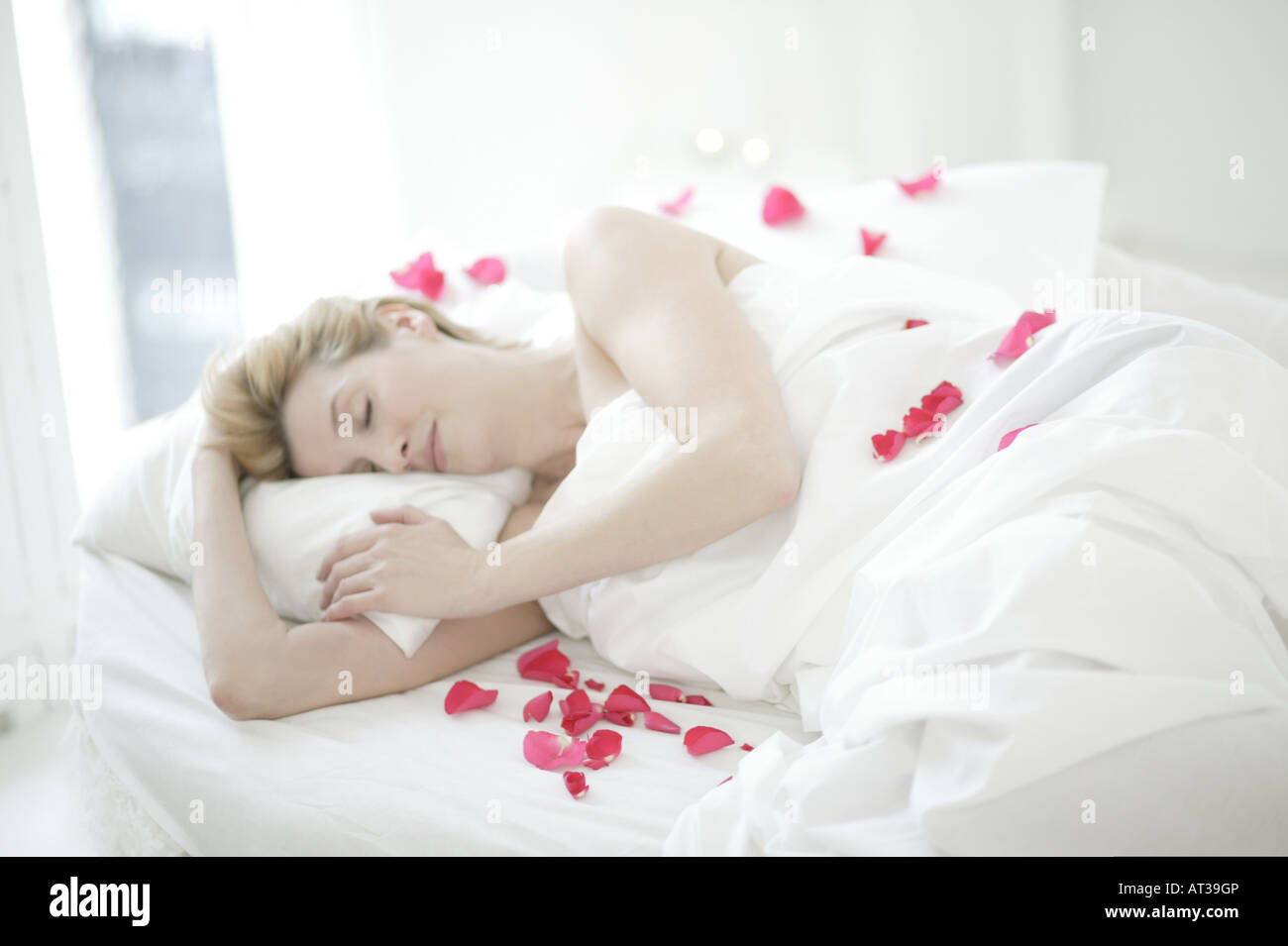 Woman On Bed Rose Petals High Resolution Stock Photography And Images Alamy