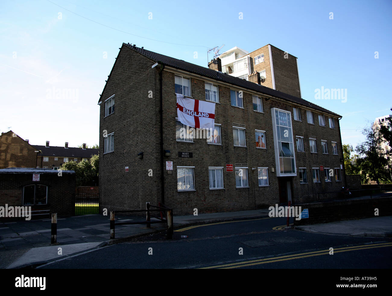 Cross of St George flag hanging from block of flats, 2006 World Cup, Hammersmith, London Stock Photo