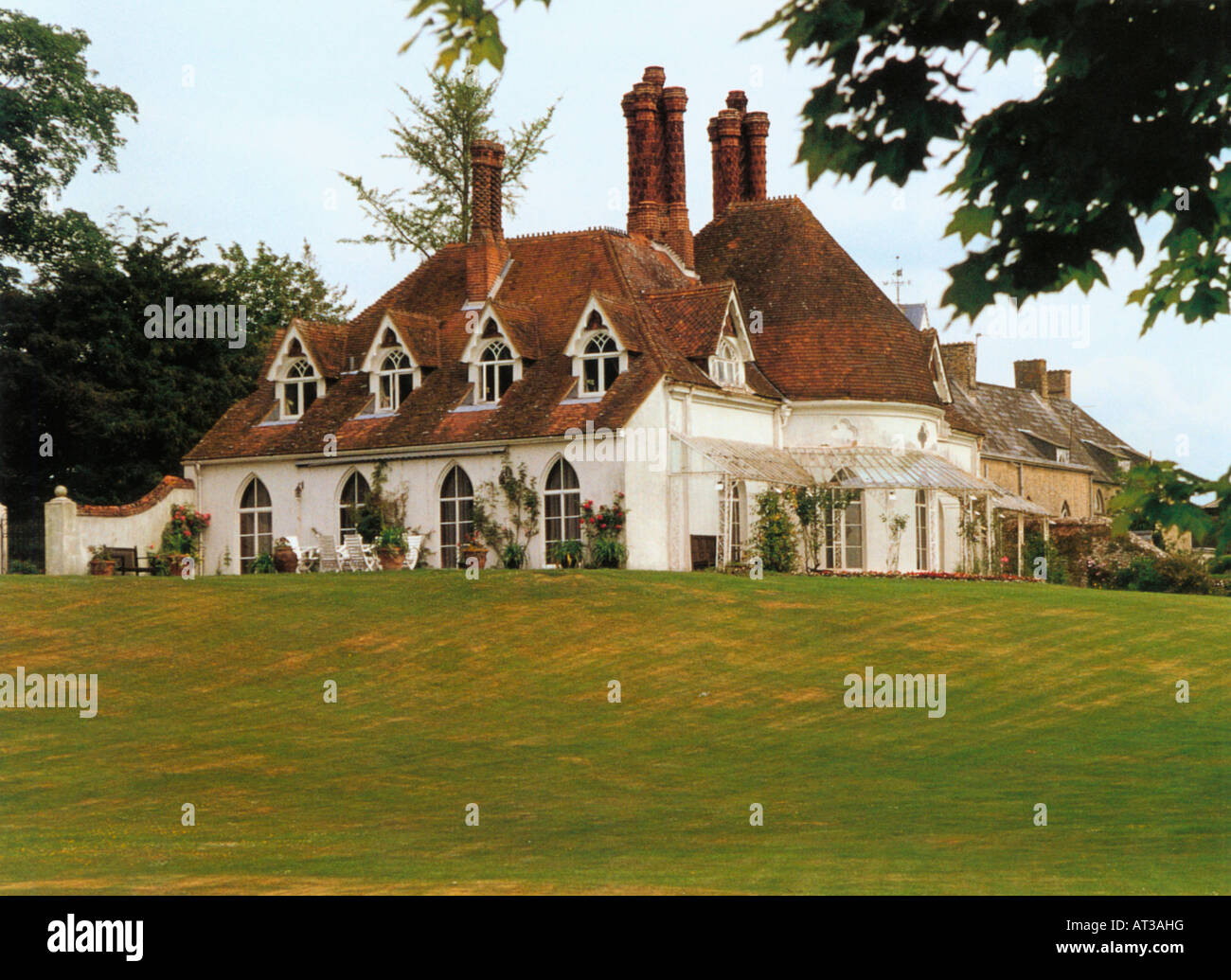 Edwardian country house with tall chimneys and gable windows Stock Photo