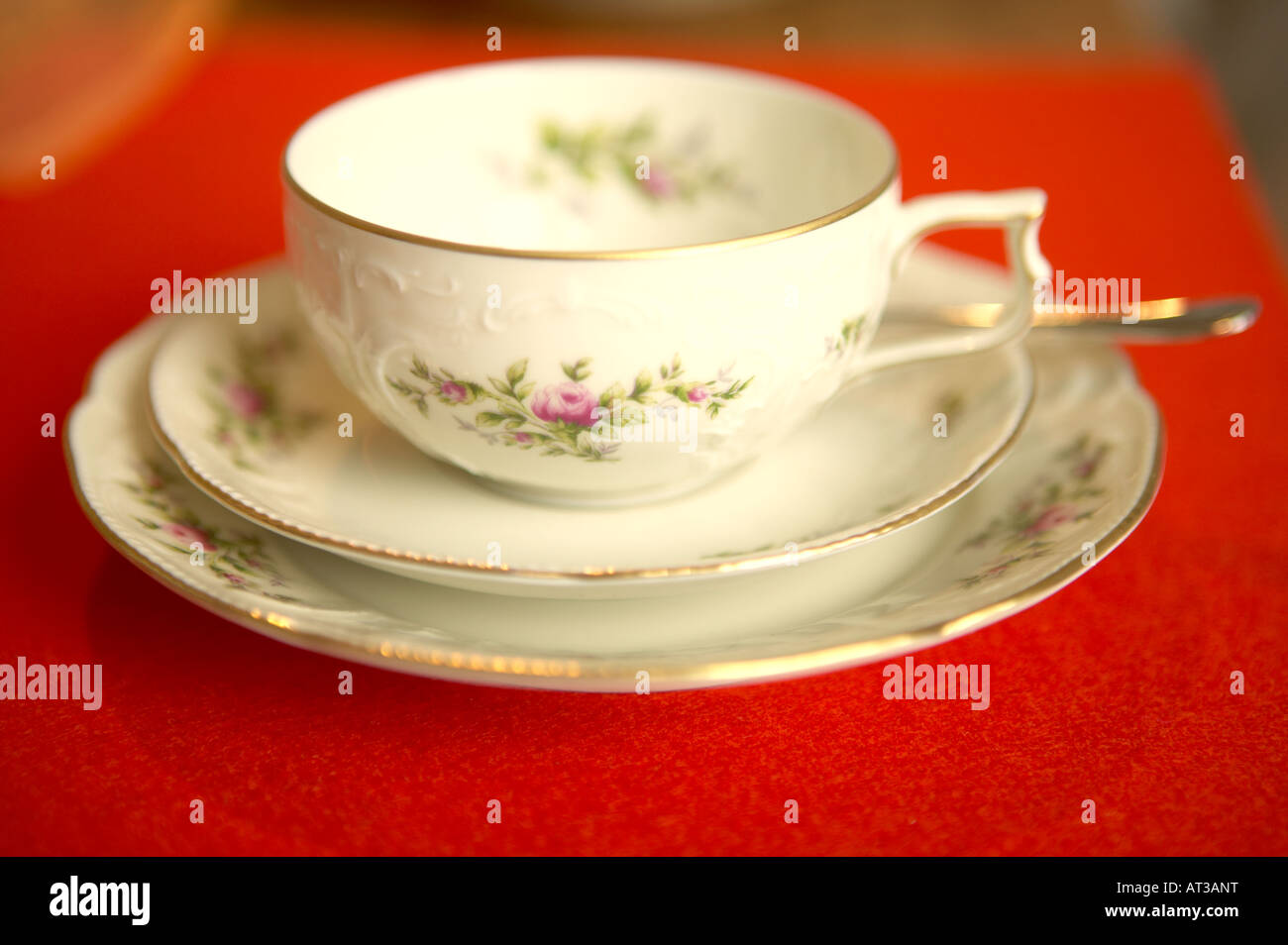 A bone china cup, saucer and plate with a floral design Stock Photo