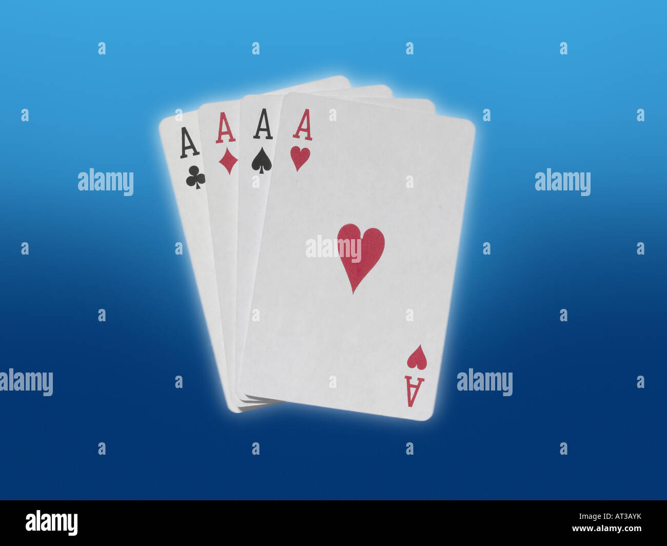 Four ace playing cards, blue background Stock Photo