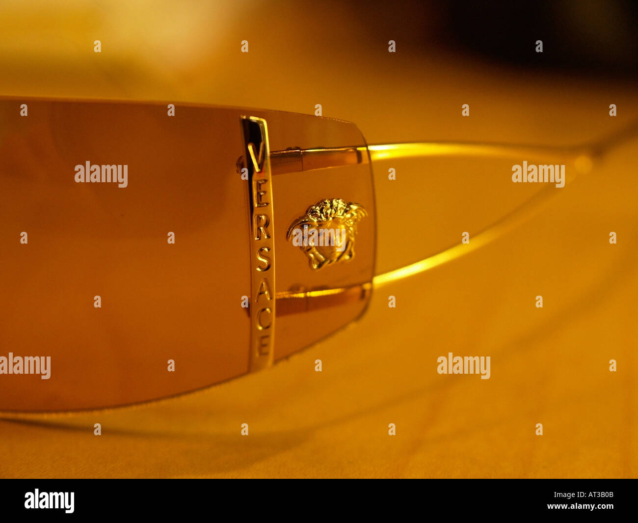 Versace sunglasses detail with name and head logo Stock Photo Alamy