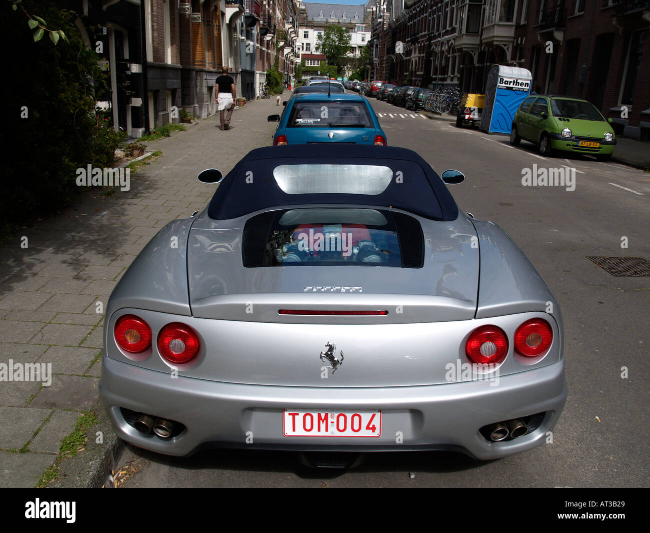 Rear side of a silver Ferrari sportscar with Belgian vanity plates parked in Amsterdam the Netherlands Stock Photo