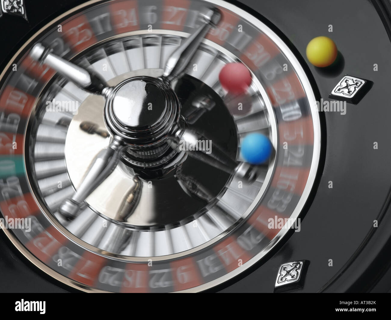 A roulette wheel with yellow, blue and red balls Stock Photo Alamy