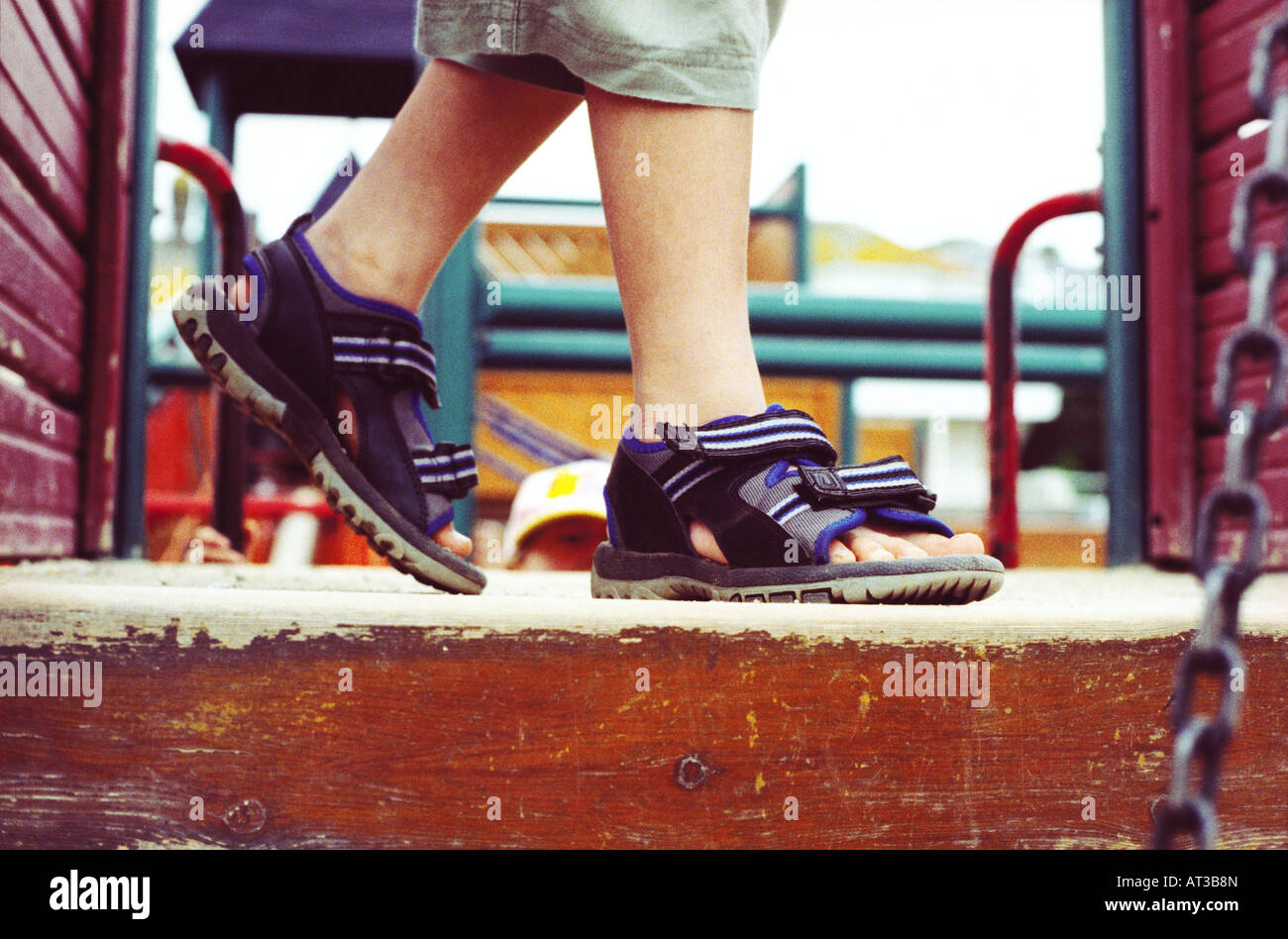 A child on a climbing frame, close-up of feet Stock Photo
