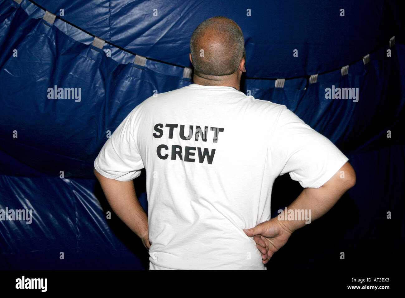 A stunt crew member watching a stunt being staged Stock Photo