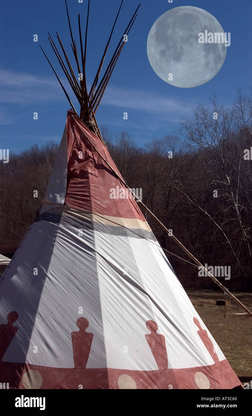 Indian native american teepee shelter with full moon overhead Stock Photo