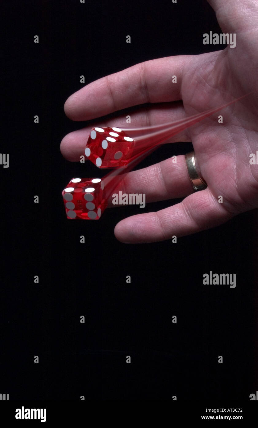 Hand throwing dice with motion trail Stock Photo Alamy