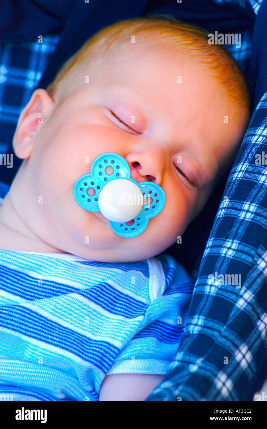 infant alseep in car seat with pacifier Stock Photo Alamy