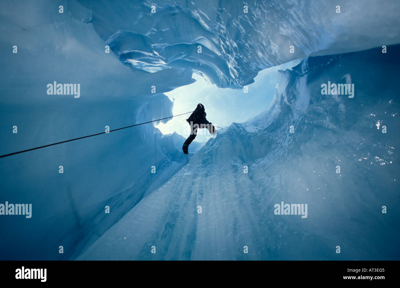 Vertical view abseiling ice cave shaft Fox Glacier New Zealand Stock