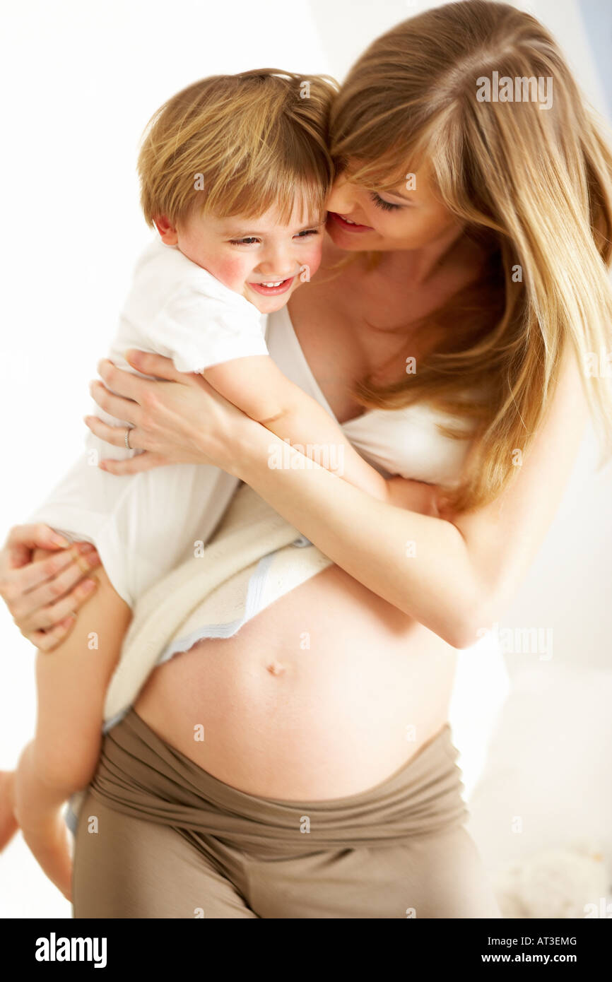 Smiling young boy in mother's arms Stock Photo