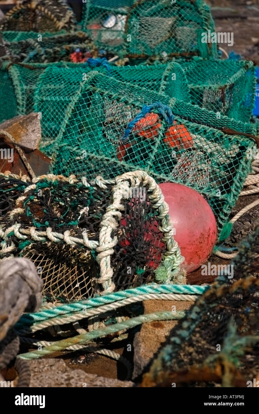 Lobster Pots and Buoys on Scarinish Harbour Wall Stock Photo