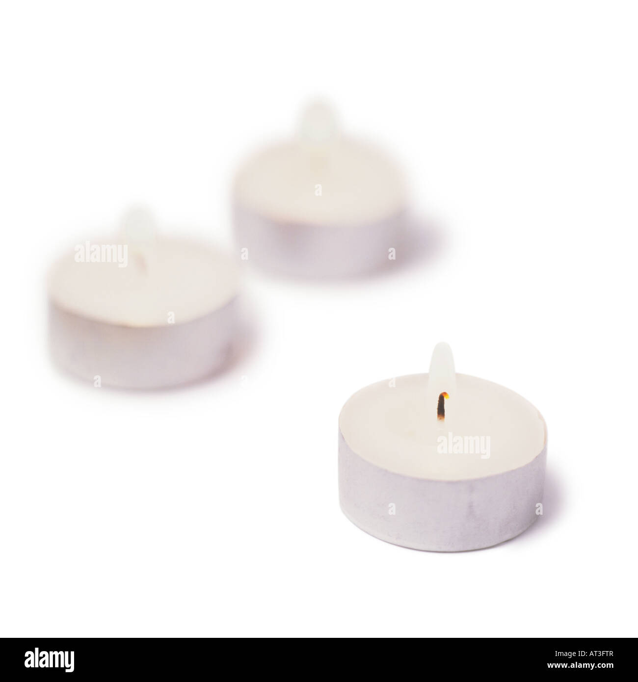 Three burning tea light candles Stock Photo