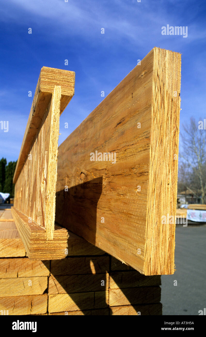 End view of a laminated header on right and I-beam, engineered wood beams. Stock Photo