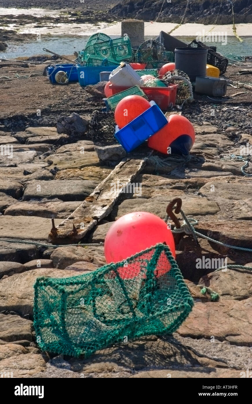 Lobster Pots and Buoys on Scarinish Harbour Wall Stock Photo