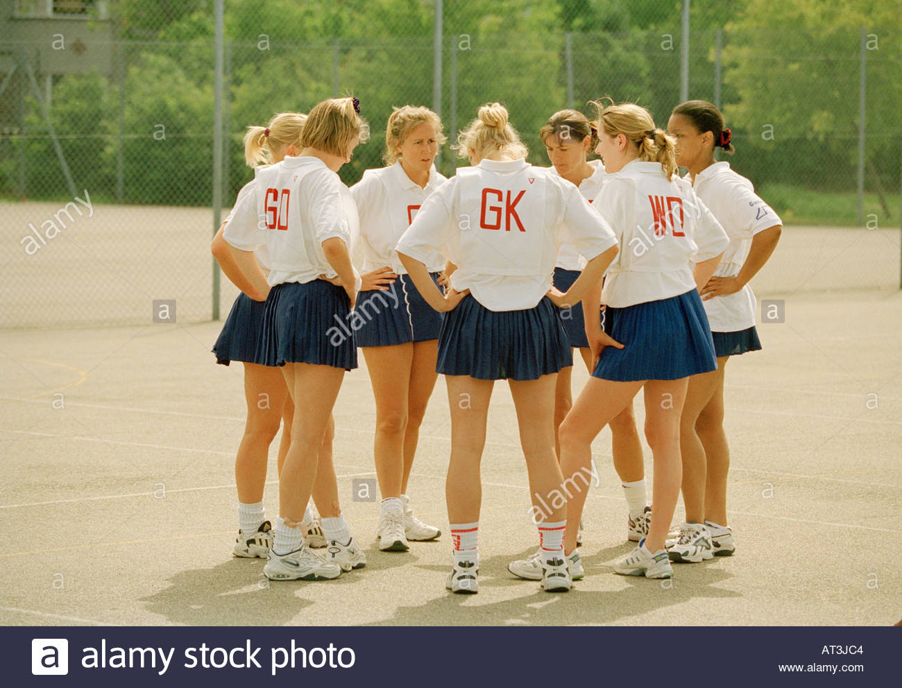 women-s-netball-team-grouped-in-a-circle-stock-photo-5285571-alamy