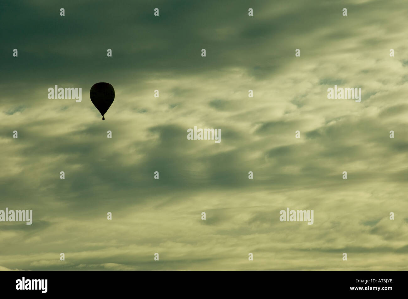 Hot air balloon high in the sky Stock Photo Alamy