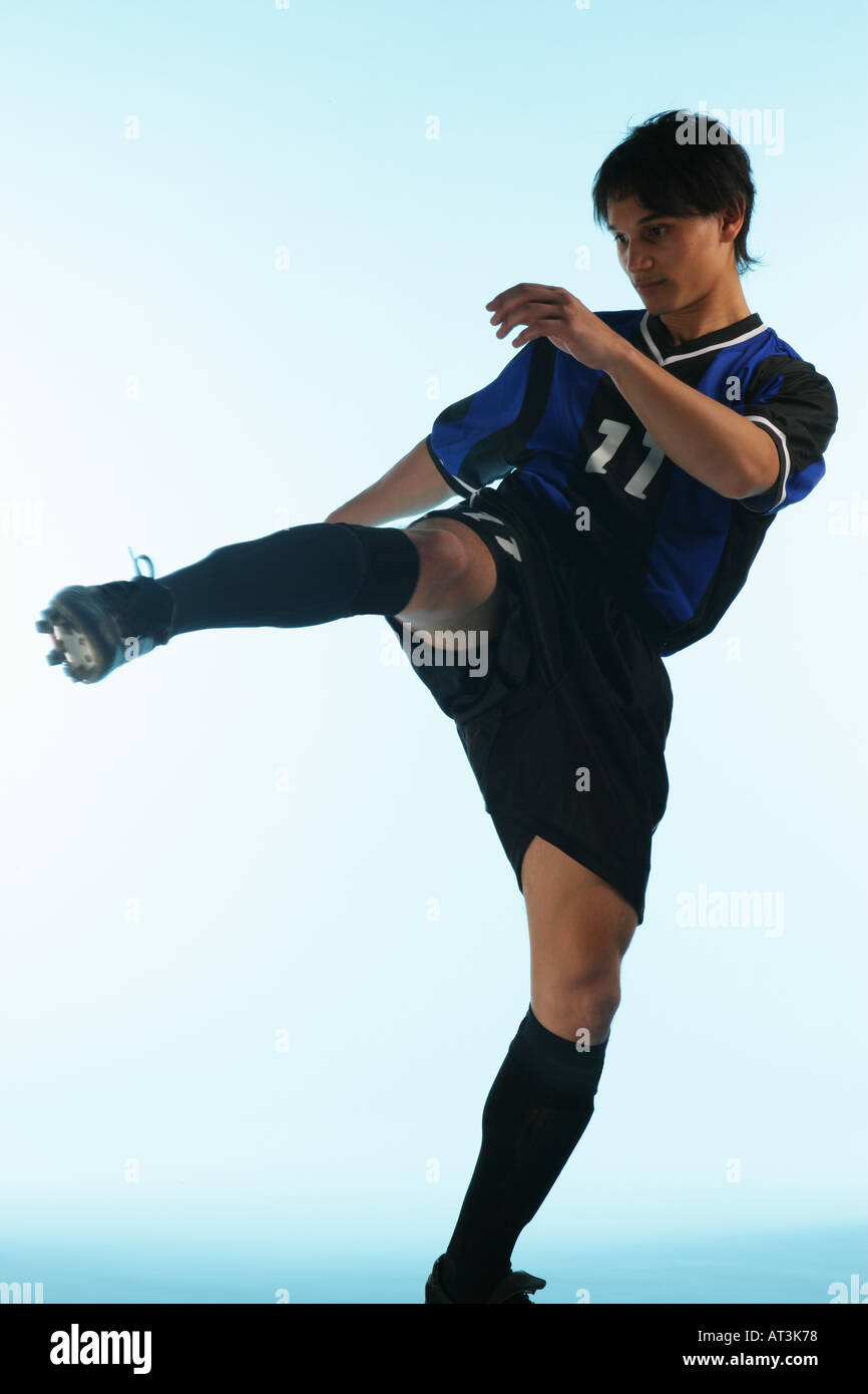 Soccer player performing martial arts Stock Photo Alamy