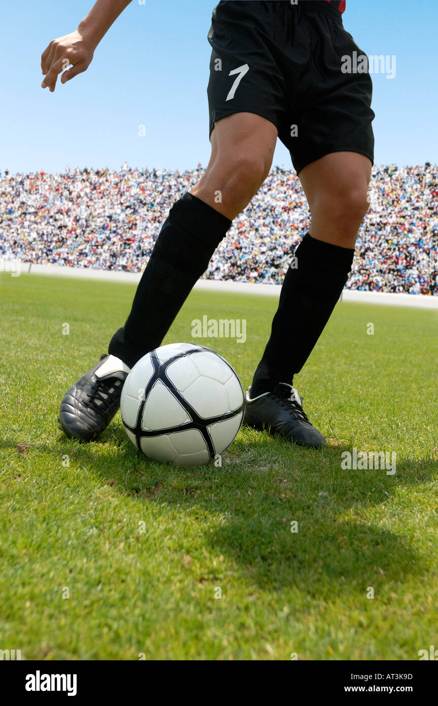 Soccer player striking ball Stock Photo Alamy
