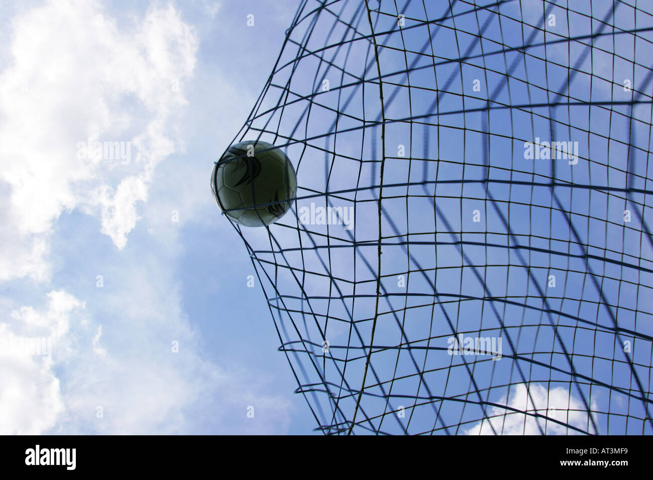 Soccer ball hitting back of net Stock Photo Alamy