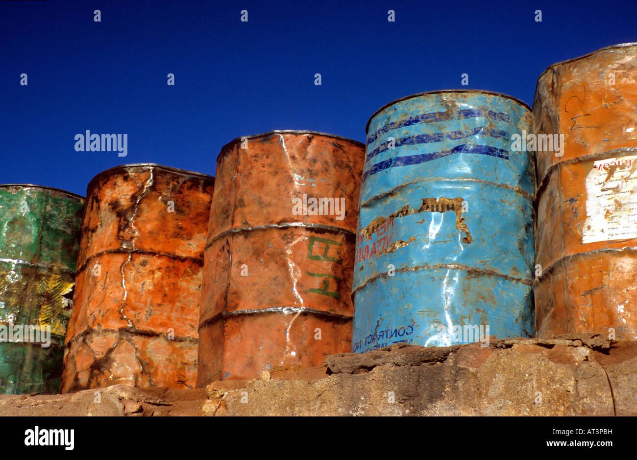 Brightly painted oil drums, Mopti harbour, Mali, West Africa Stock Photo