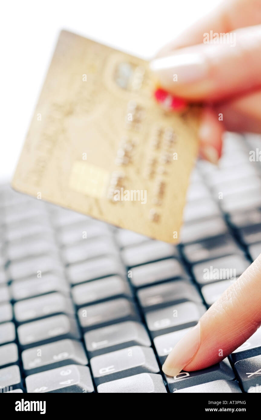 Hand with a Credit Card and Computer Keyboard Stock Photo