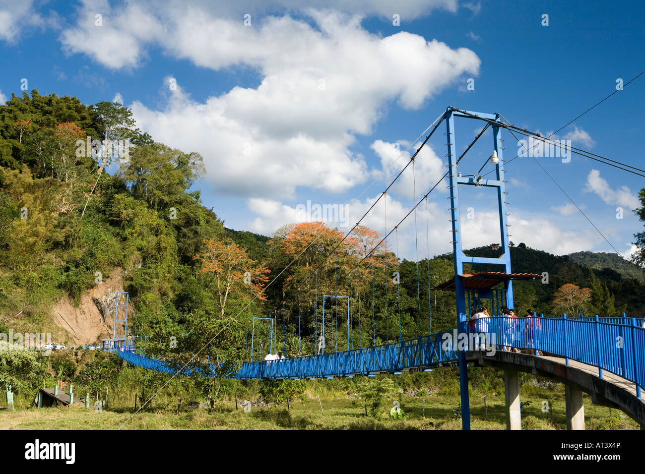 Costa Rica Orosi new blue painted pedestrian suspension bridge crossing
