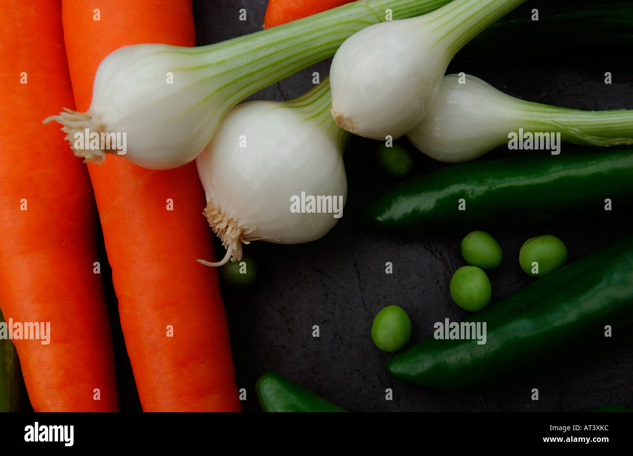 Carrots Peas and Spring Onions Stock Photo Alamy