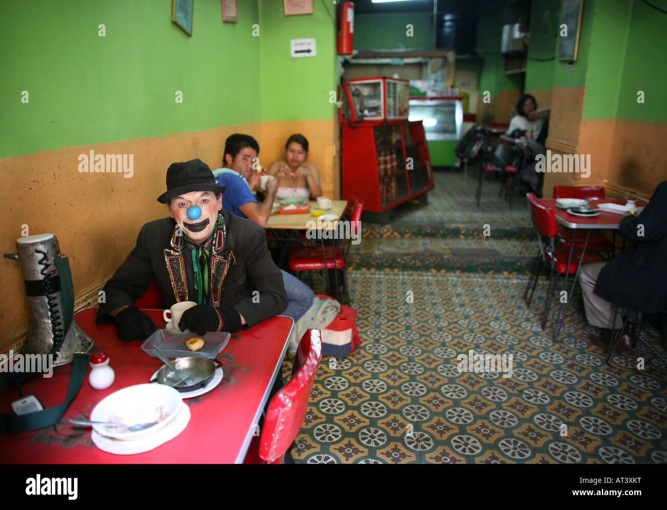 Clown having lunch in Bogota Stock Photo