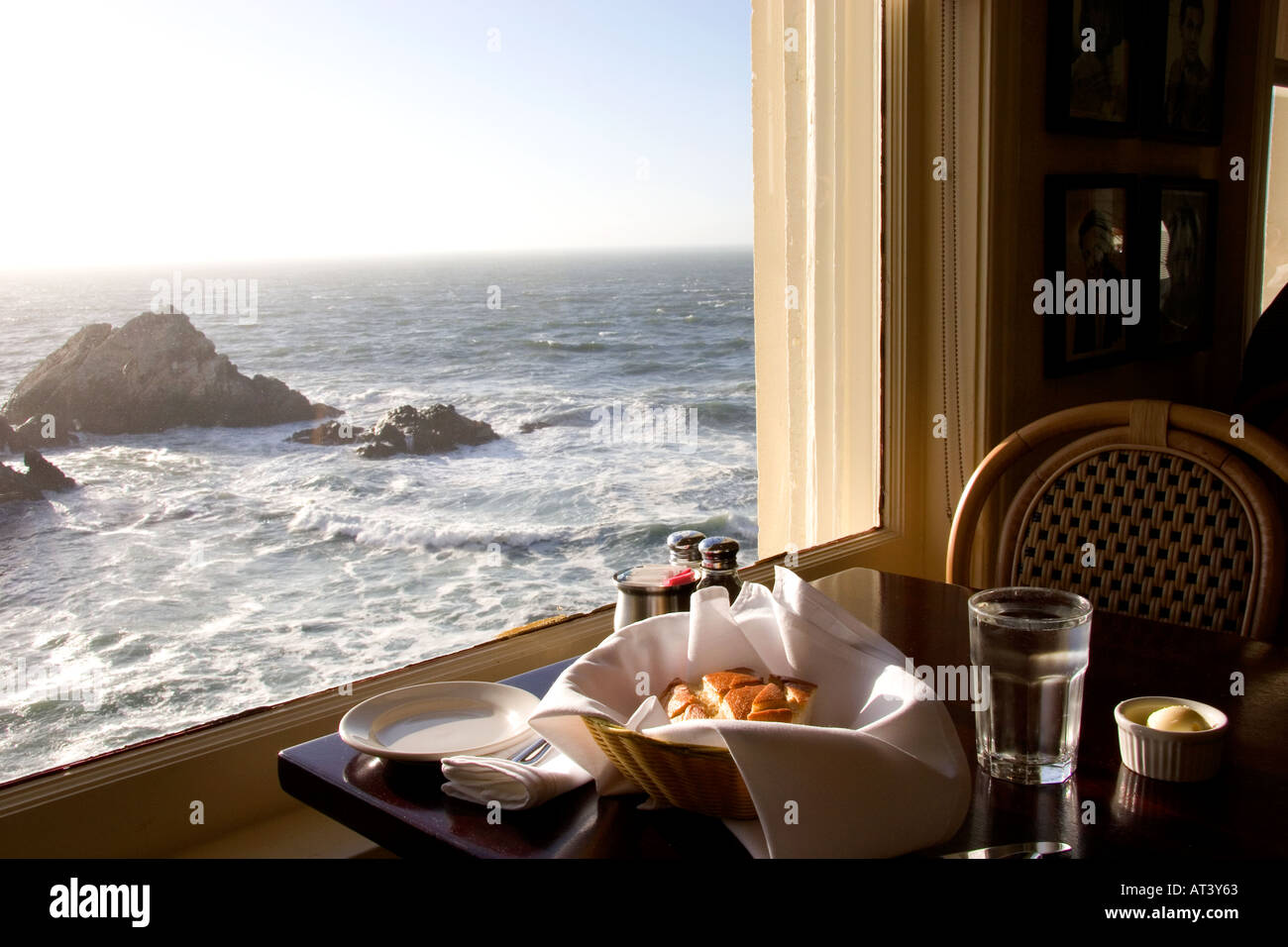 A view of the ocean and a basket of sourdough bread at The Cliff House Restaurant on the San Francisco Coast, California. Stock Photo