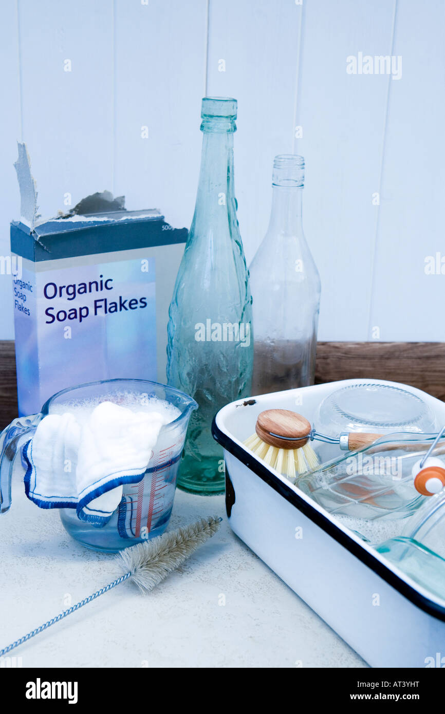 Enamel Washing up bowl, soap flakes and glassware Stock Photo Alamy