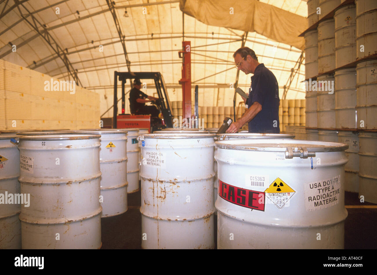 Drums of radioactive nuclear waste are sorted by employees at the Idaho