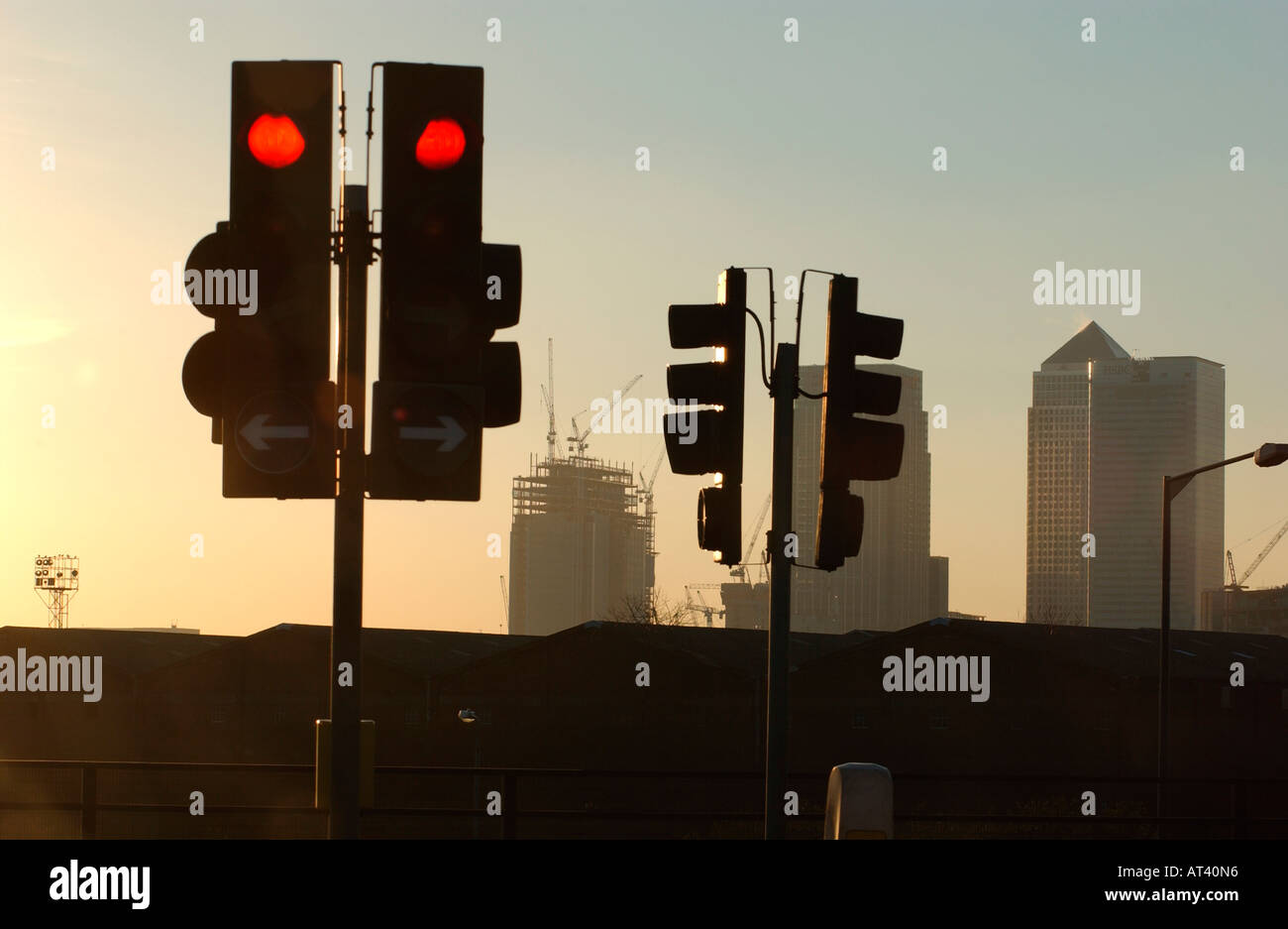 Traffic lights on red with Canary Wharf, London,construction site in distance Stock Photo