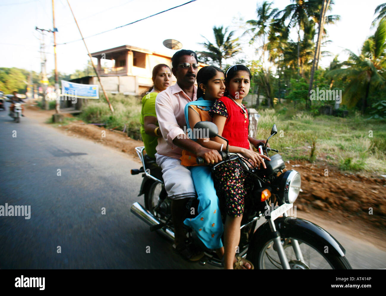 A toung indian family all on a motorbike in india Stock Photo