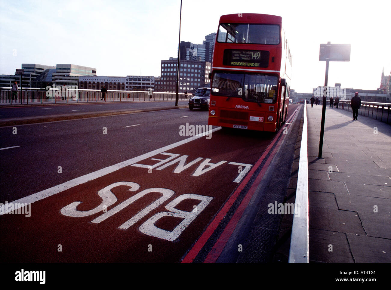 Red double decker bus in London bus lane Stock Photo