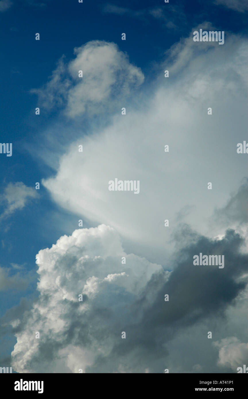 Background image Dramatic large dark grey and white clouds against blue ...