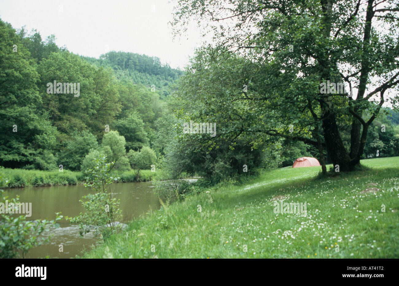 tent on camping site by the Ourthe river in the Belgian Ardennes Belgium Stock Photo