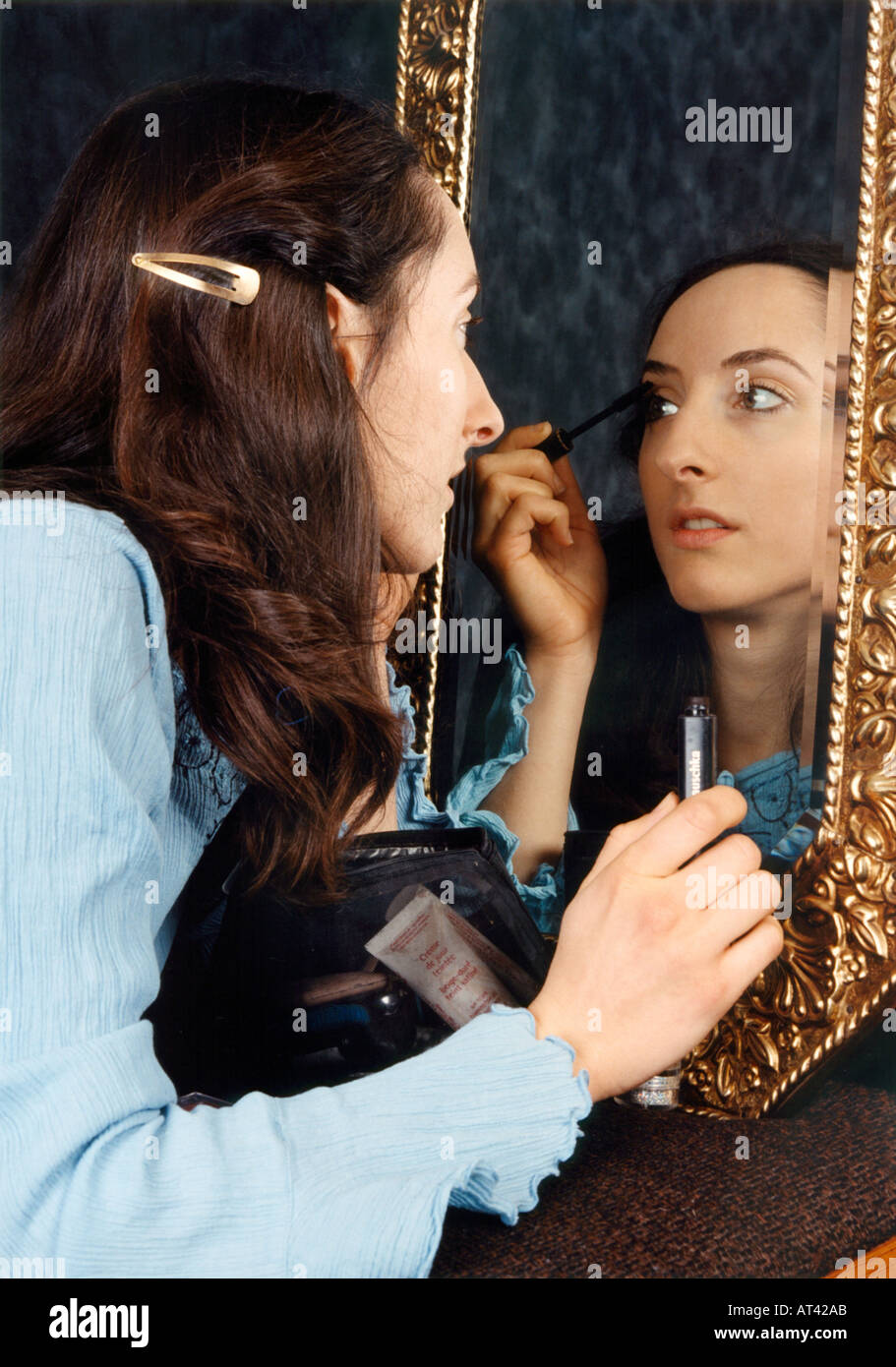 Girl Applying Makeup Stock Photo
