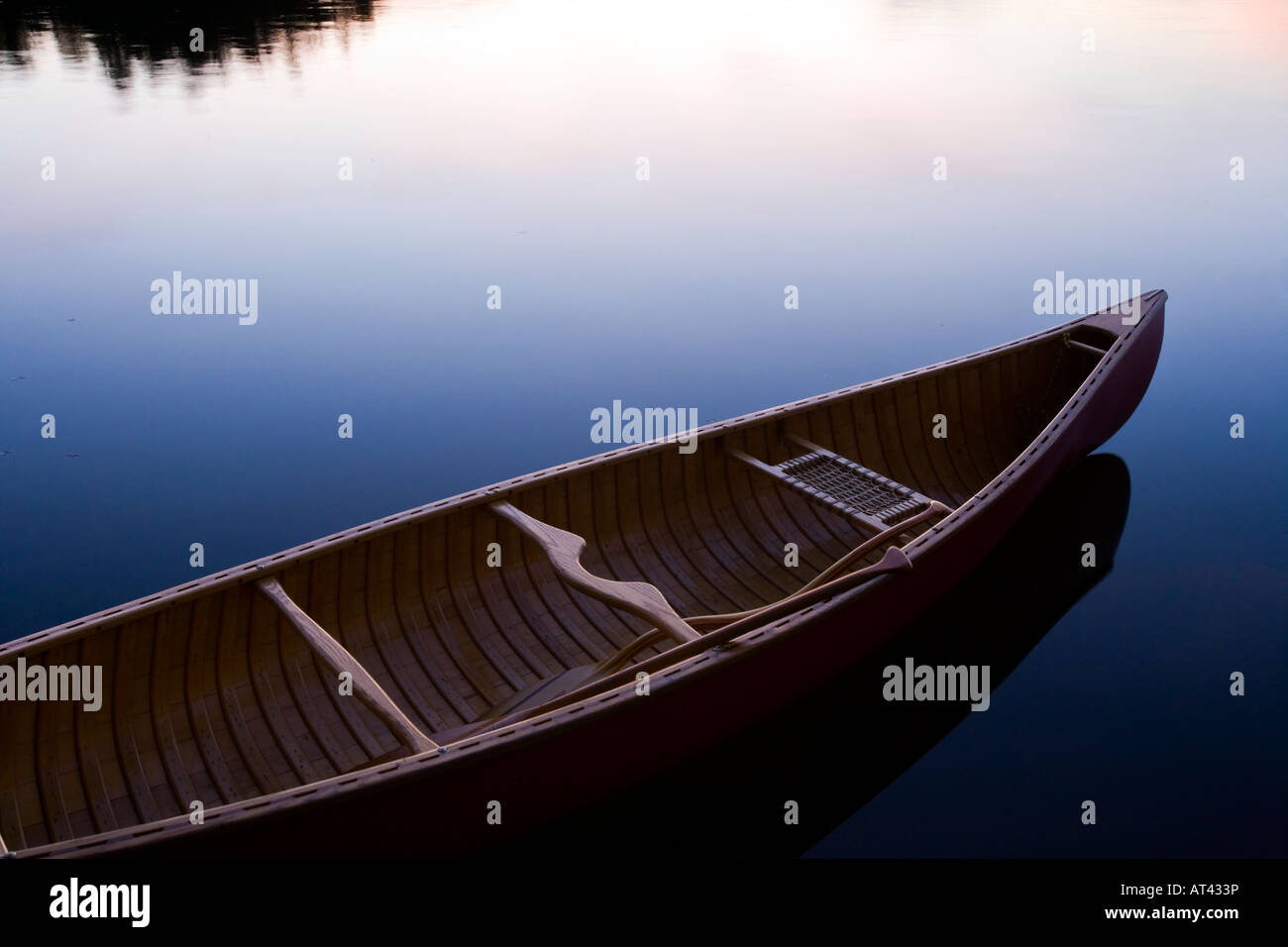 A canoe on the shoreline of Seboies Lake near Millincoket, Maine. Stock Photo