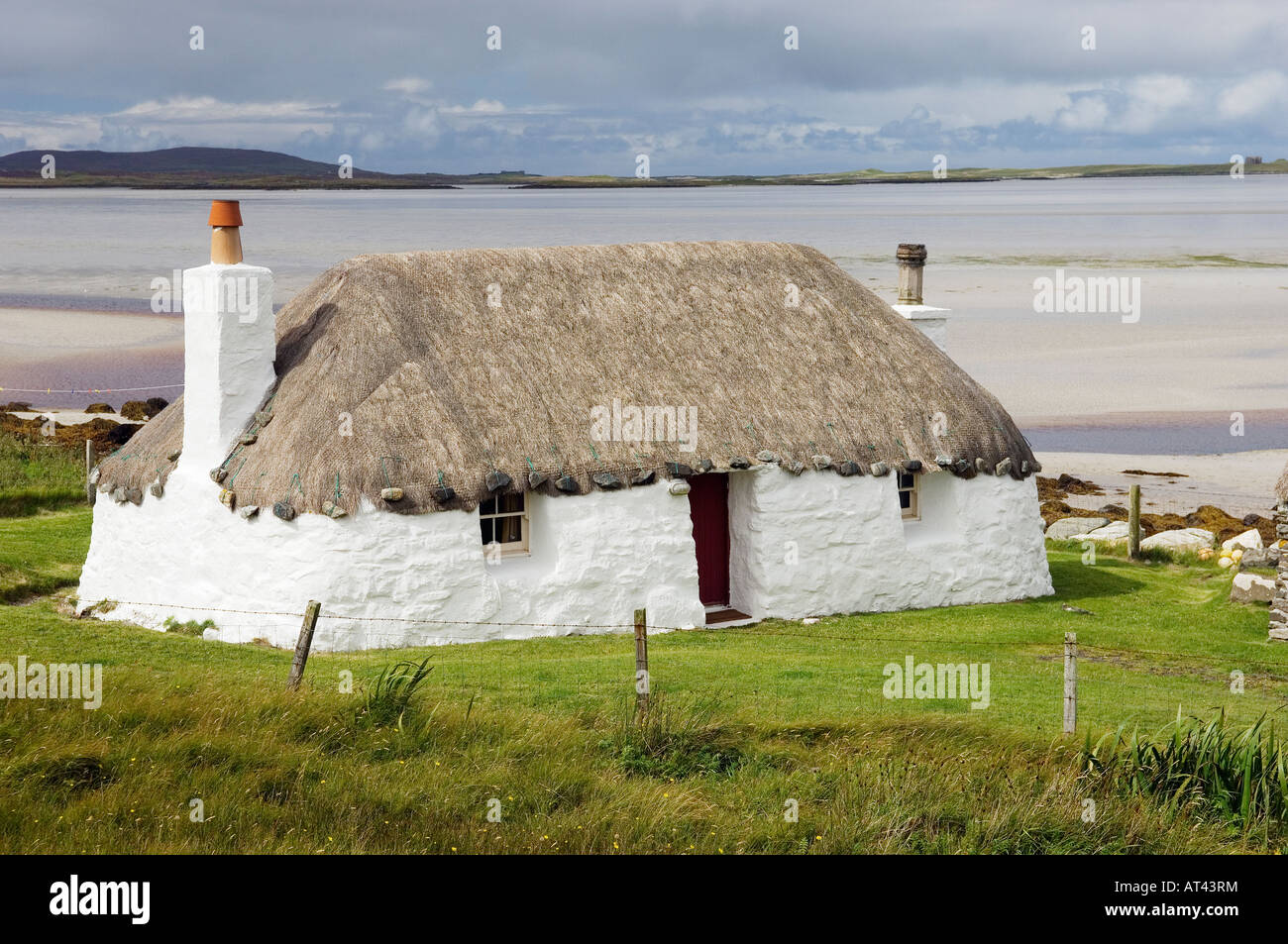 Traditional croft house thatched cottage at Malacleit on Outer Hebrides island of North Uist, Scotland Stock Photo