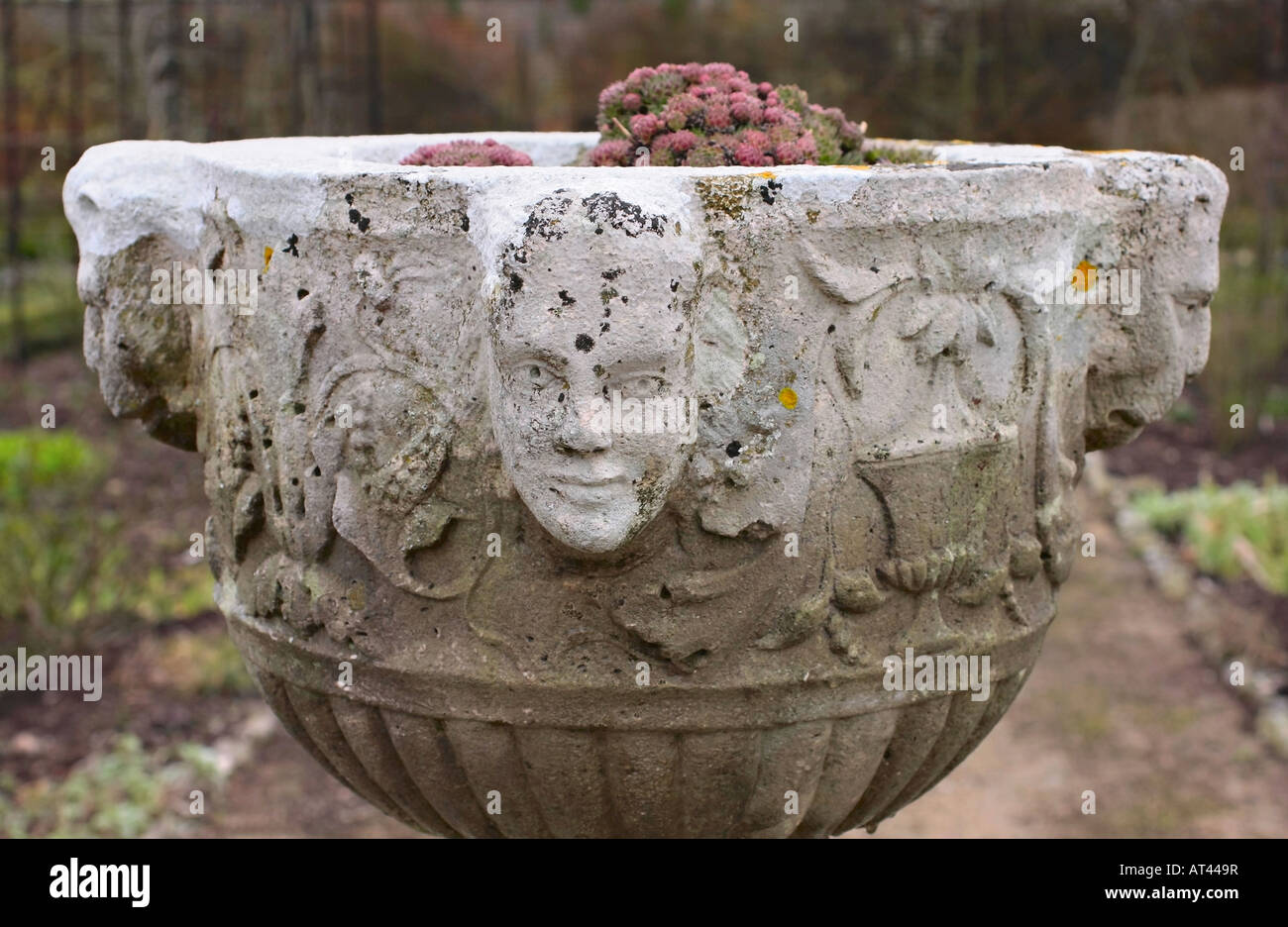 Large antique stone planter in garden Stock Photo Alamy