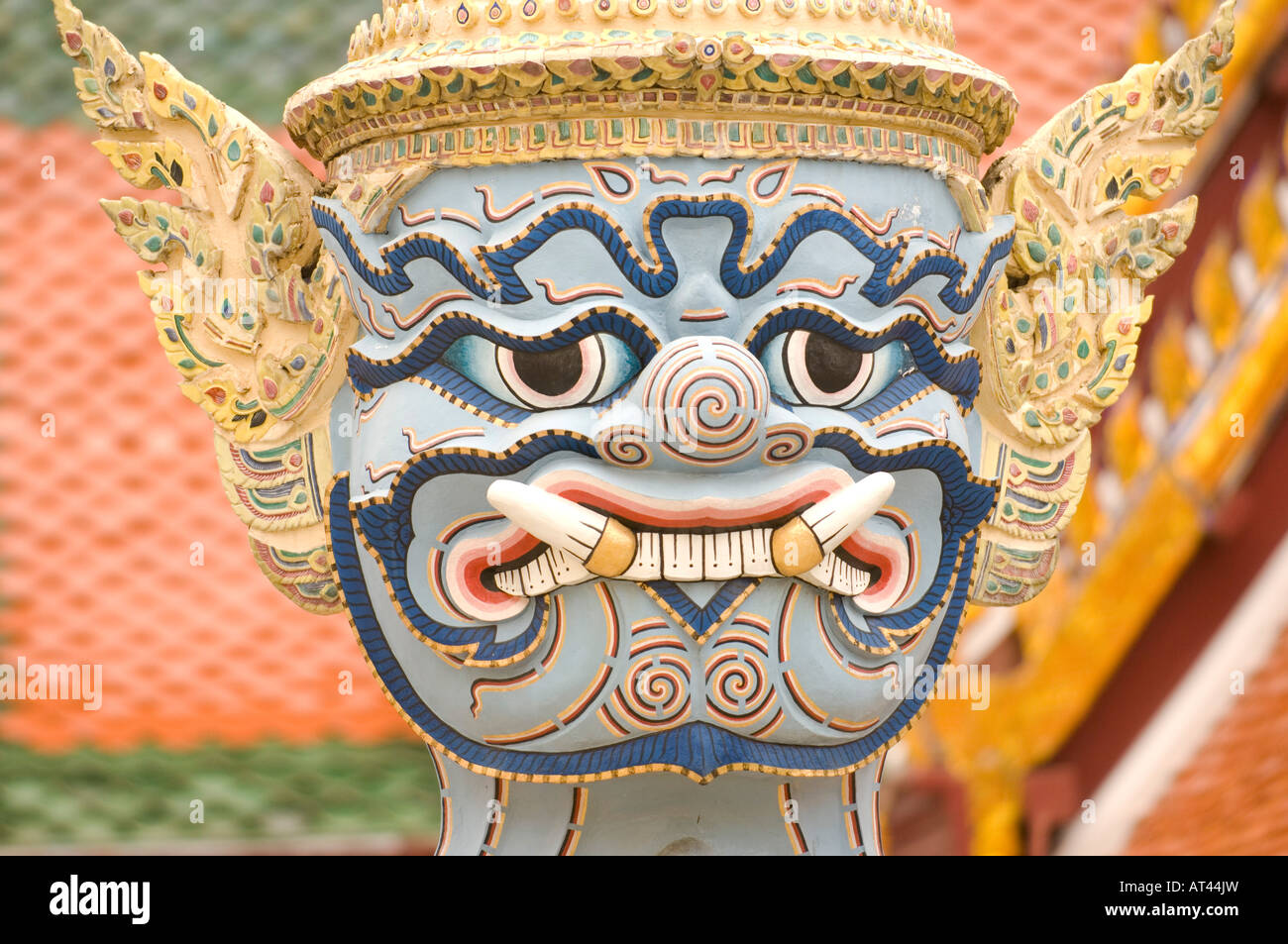 Head of a mythical beast statue on the grounds of the Grand Palace Bangkok Thailand Stock Photo