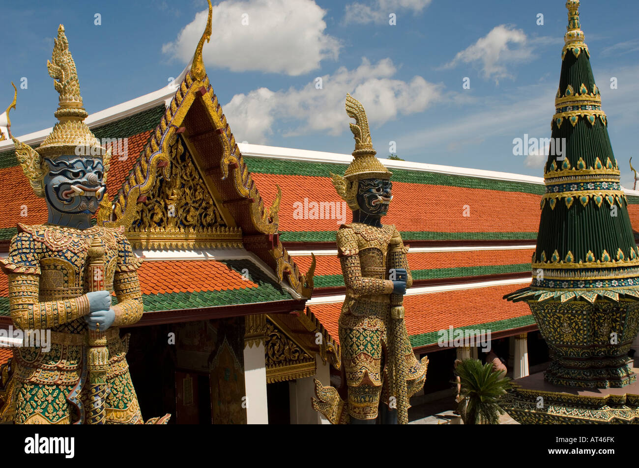Large mythical beast statues guard the entrance to the Grand Palace Bangkok Thailand Stock Photo