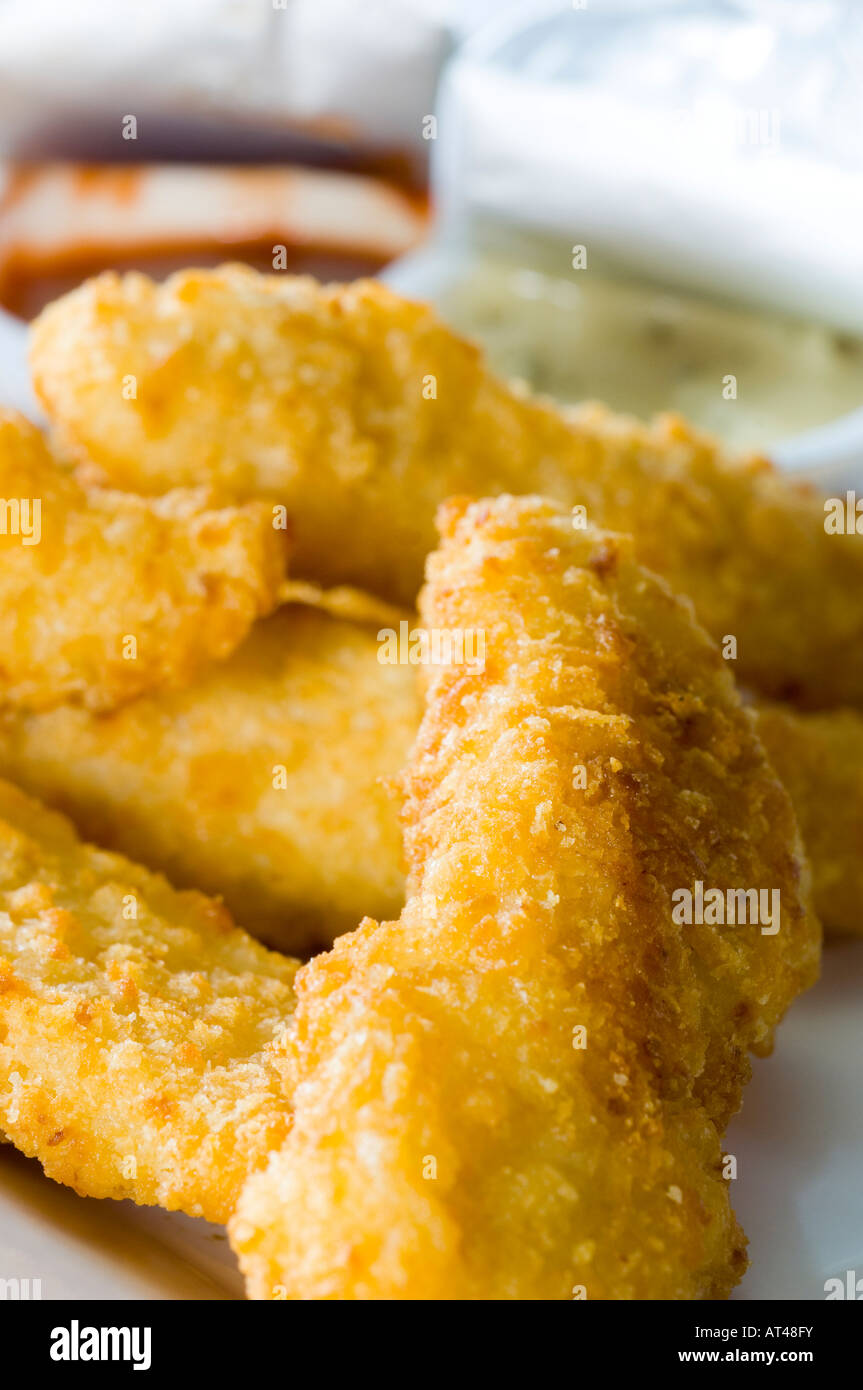 A Side order of crispy deep fried chicken with sauce dips Stock Photo