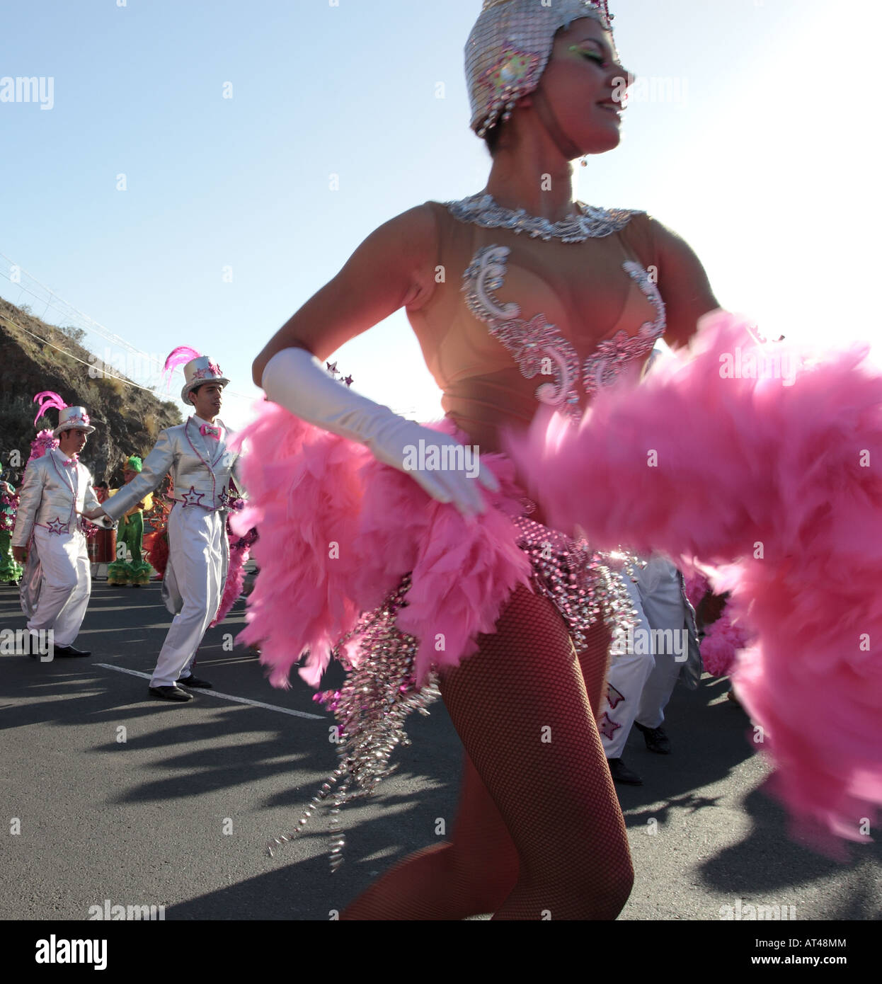 https://c8.alamy.com/comp/AT48MM/young-dancer-swirls-her-feathered-costume-in-th-carnaval-parade-los-AT48MM.jpg