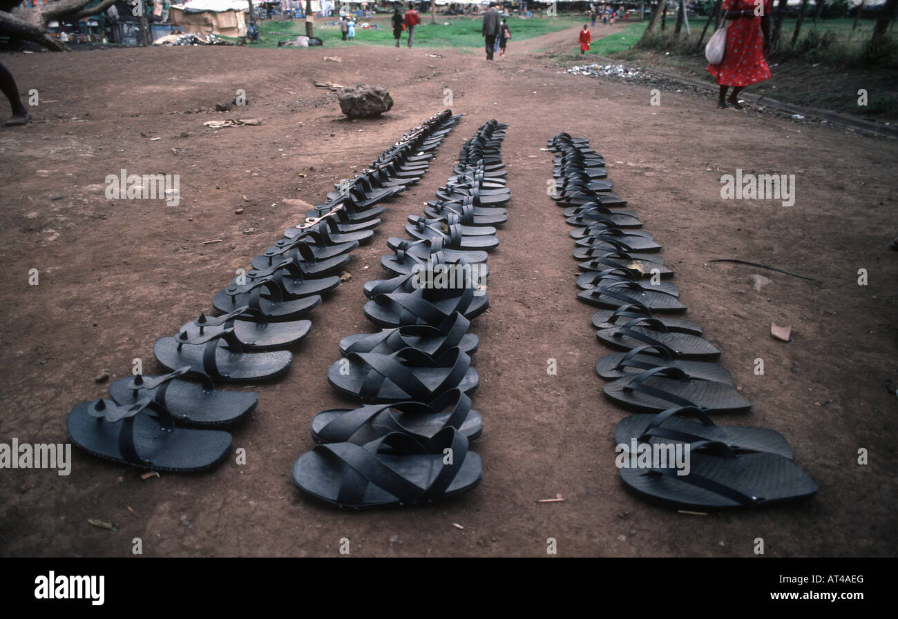 Row of rubber sandals made from used car tyres Nairobi market Kenya Stock Photo