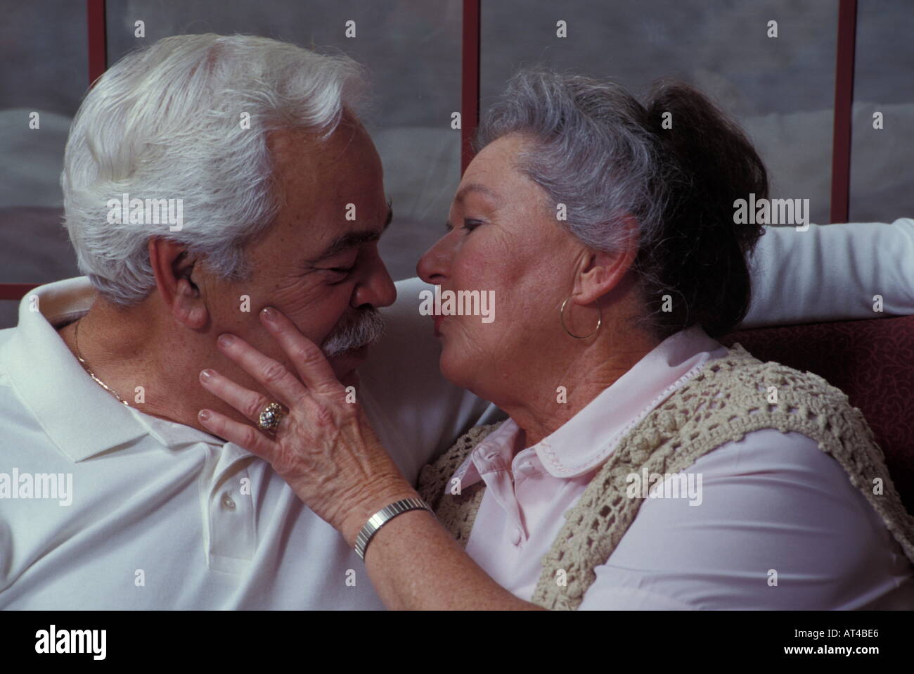 Old couple kissing hi-res stock photography and images