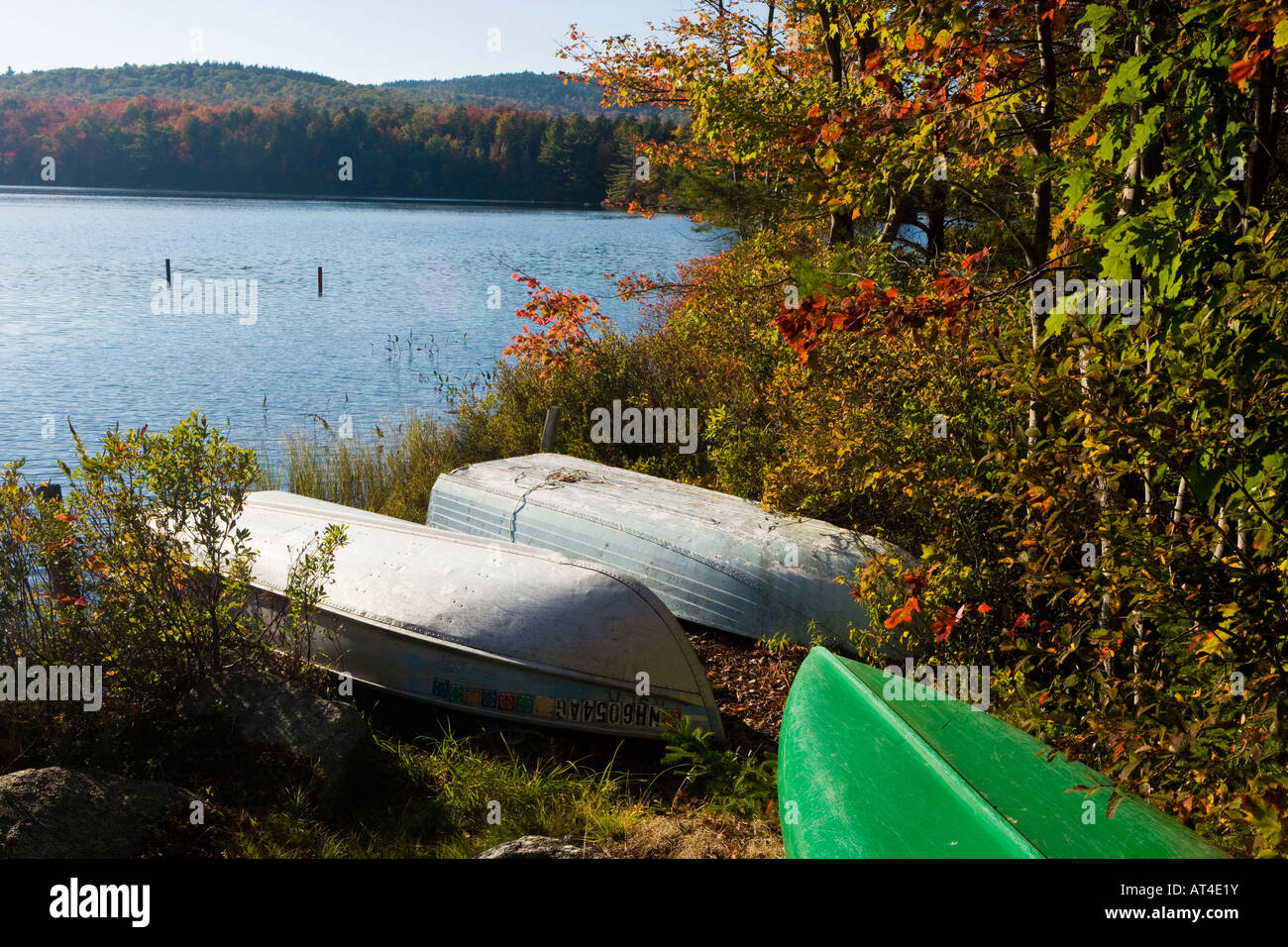 Boats on the shoreline of Long Pond in Lempster, New Hampshire Stock