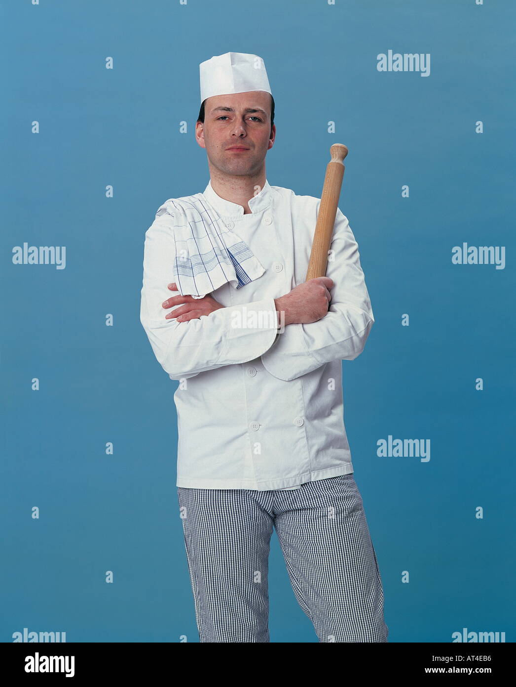 chef posing with a rolling pin Stock Photo